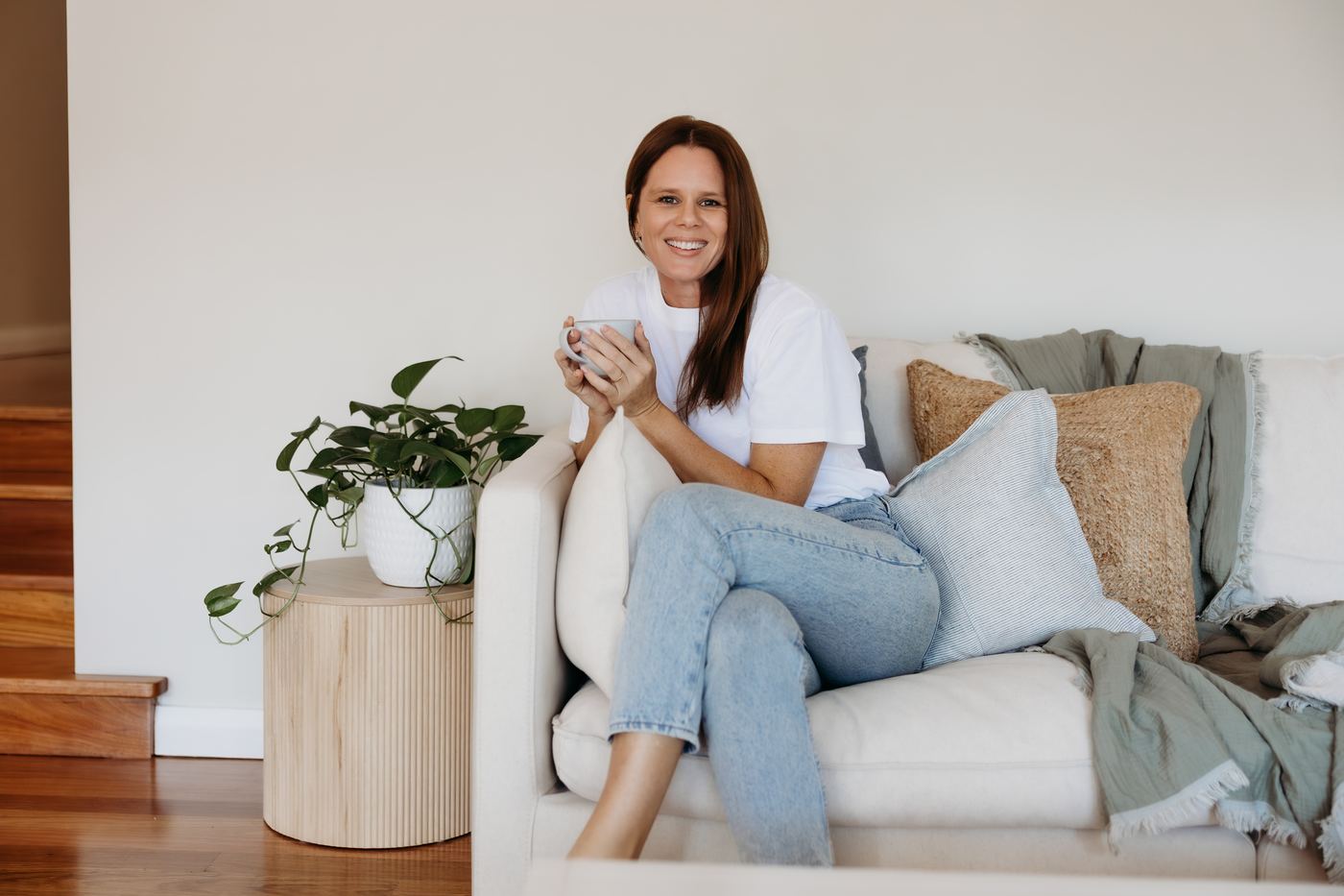 Shelley, occupational therapist at Basecamp OT, at home with a cup of tea